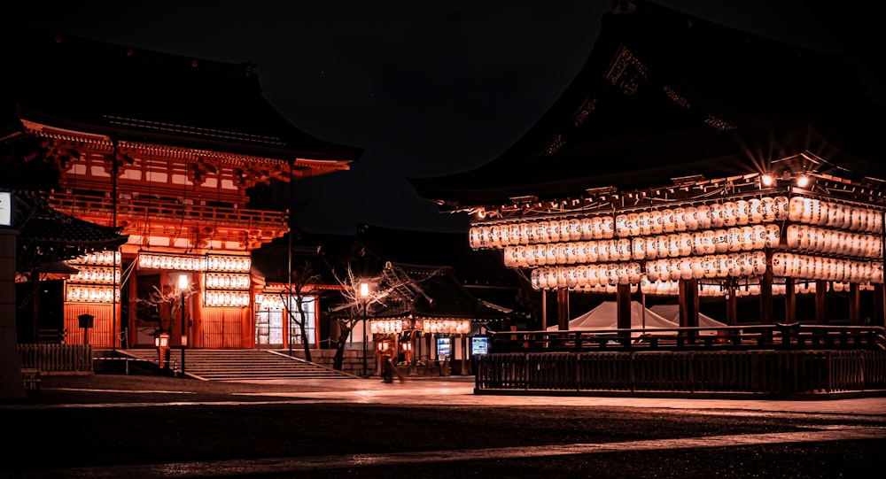 a building lit up at night with lights on it