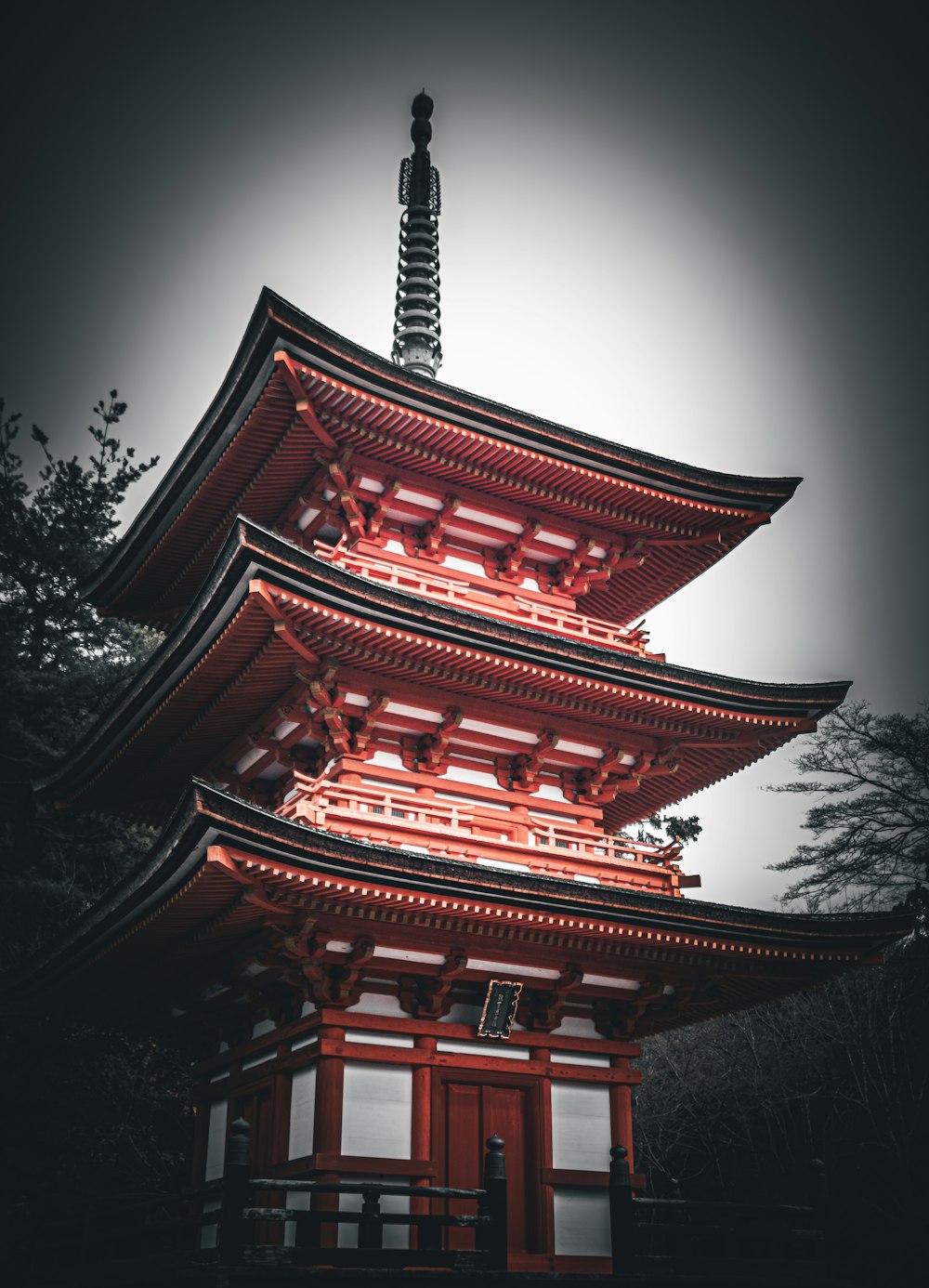 a tall red building with a tall tower