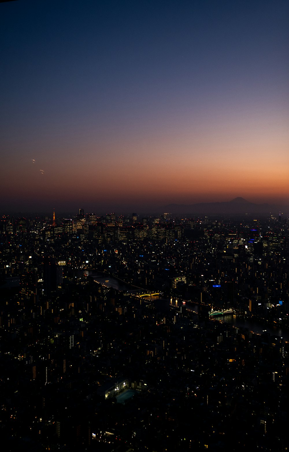 a view of a city at night from a plane