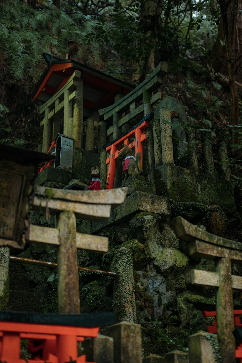 a small shrine in the middle of a forest