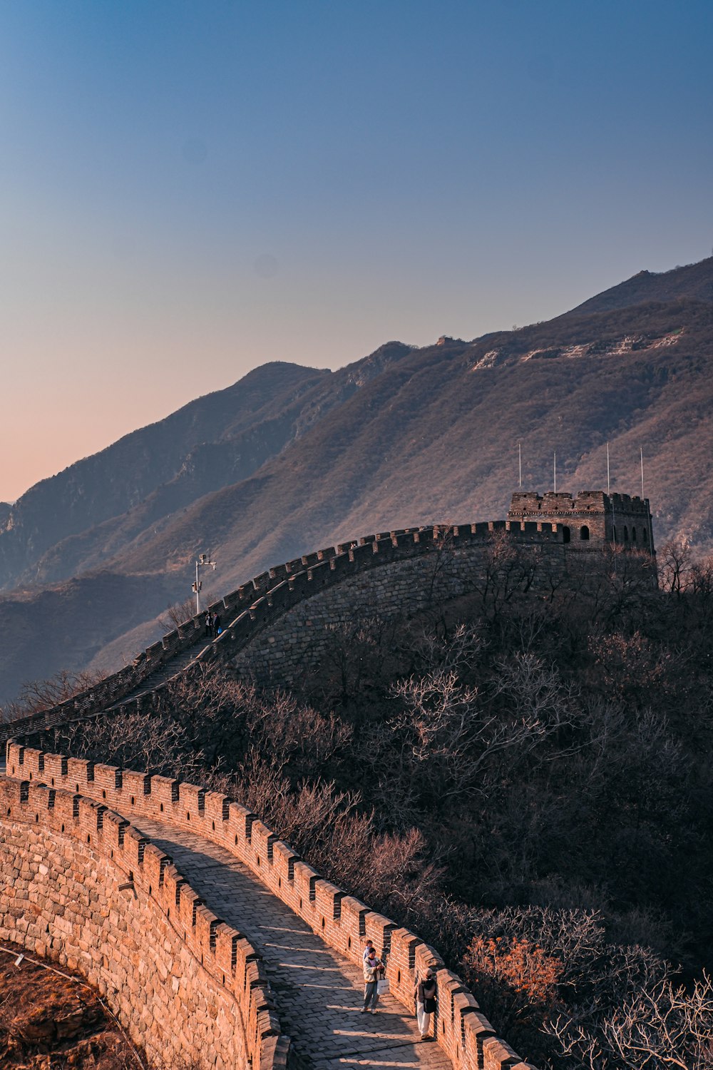 the great wall of china with people walking up it