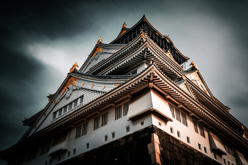 a tall building with a sky in the background