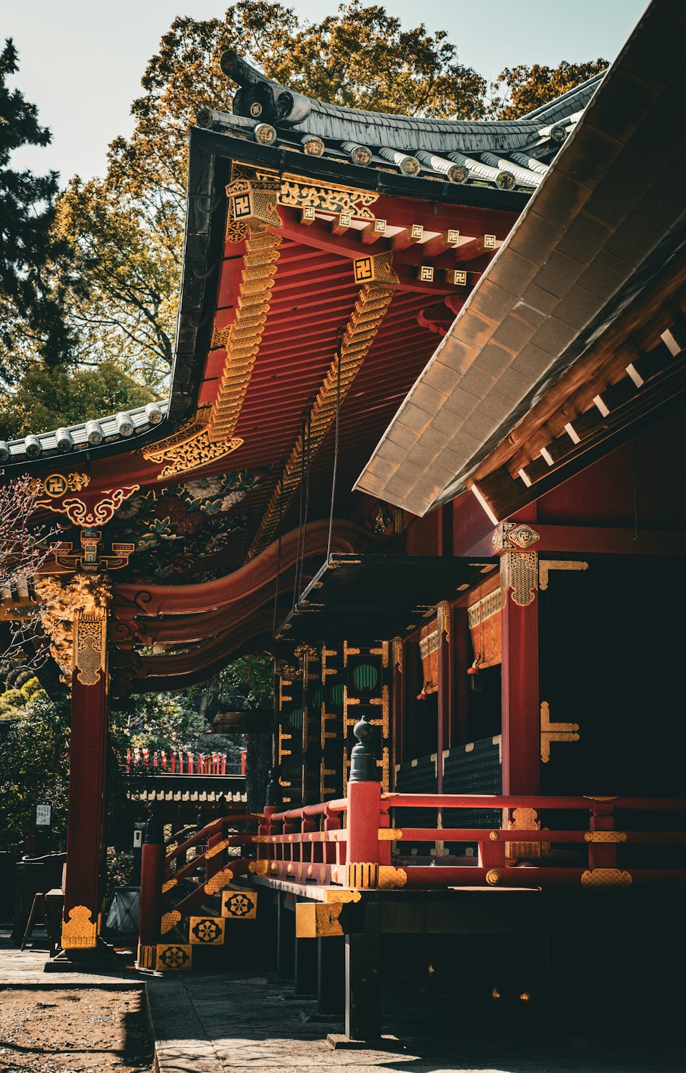 a red and yellow building with a red roof