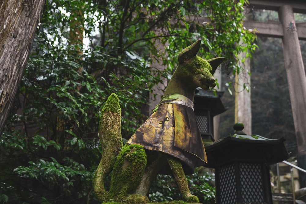 a statue of a cat in a costume