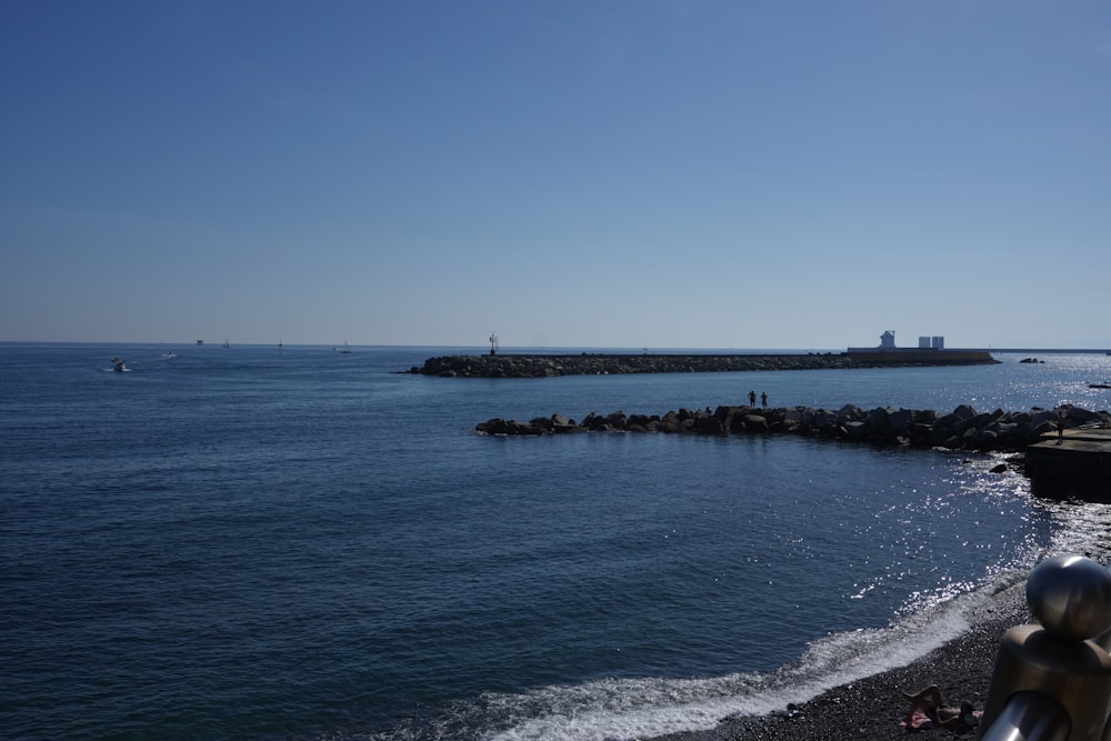 a view of the ocean from the shore of a beach