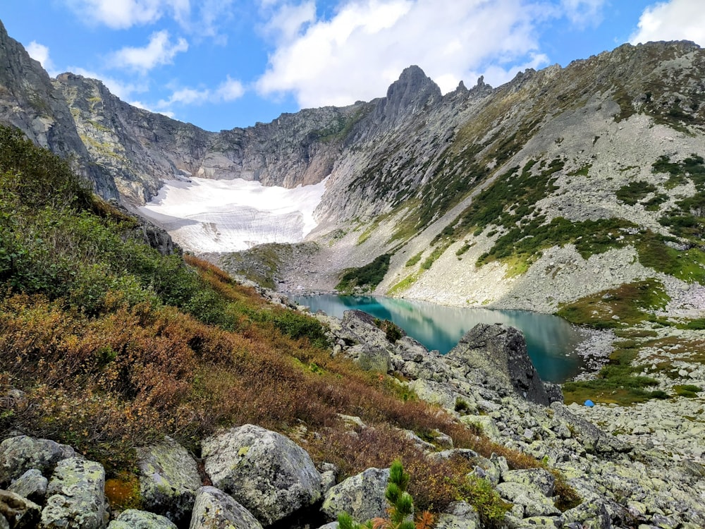 a view of a mountain with a lake in the middle of it