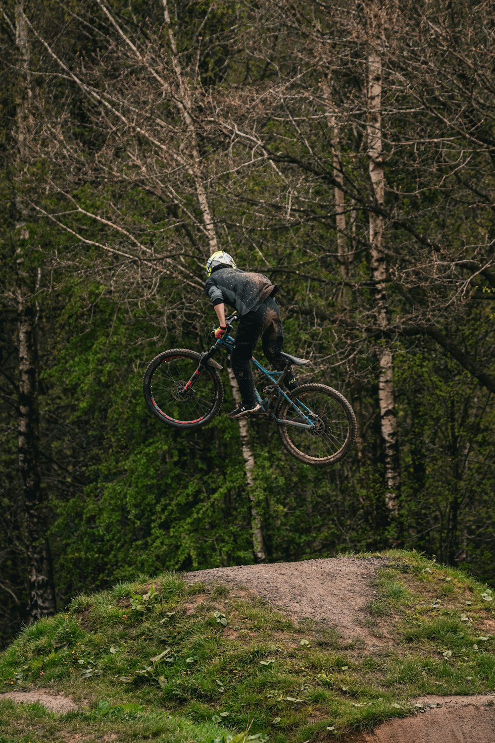 a person jumping a bike in the air