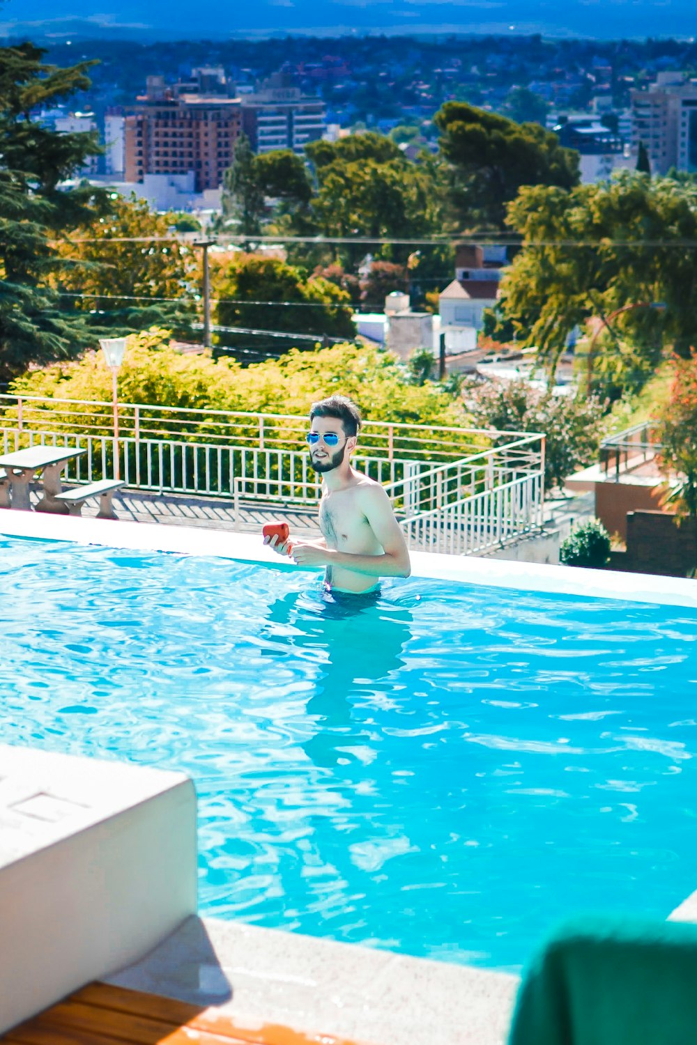 a man in a swimming pool with a mask on