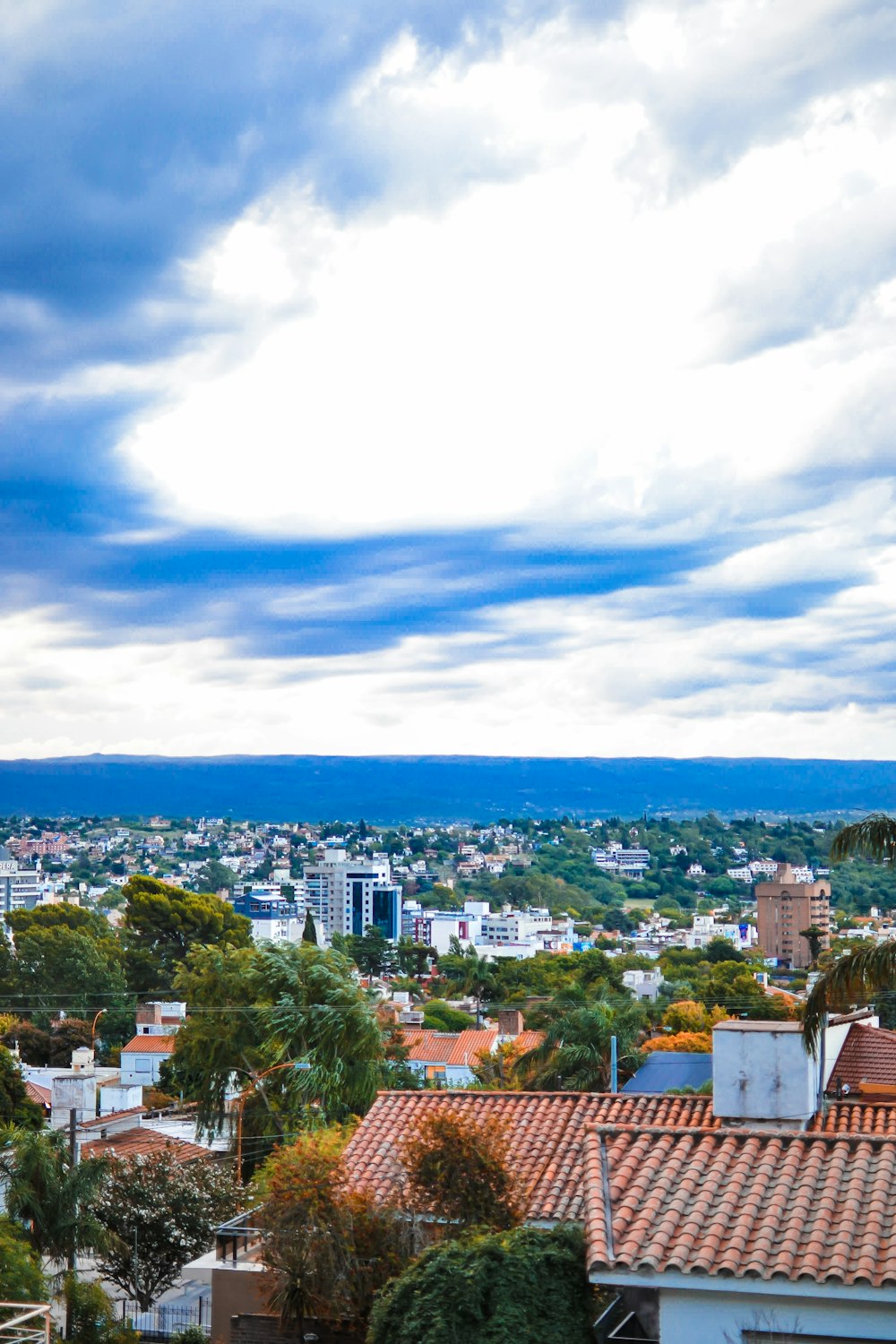 a view of a city from the top of a hill