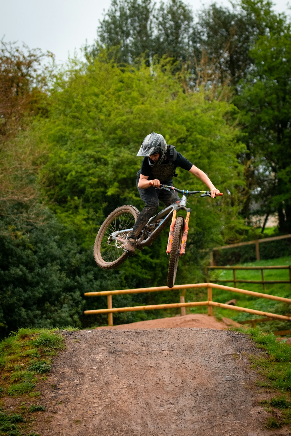 a man riding a bike up the side of a ramp