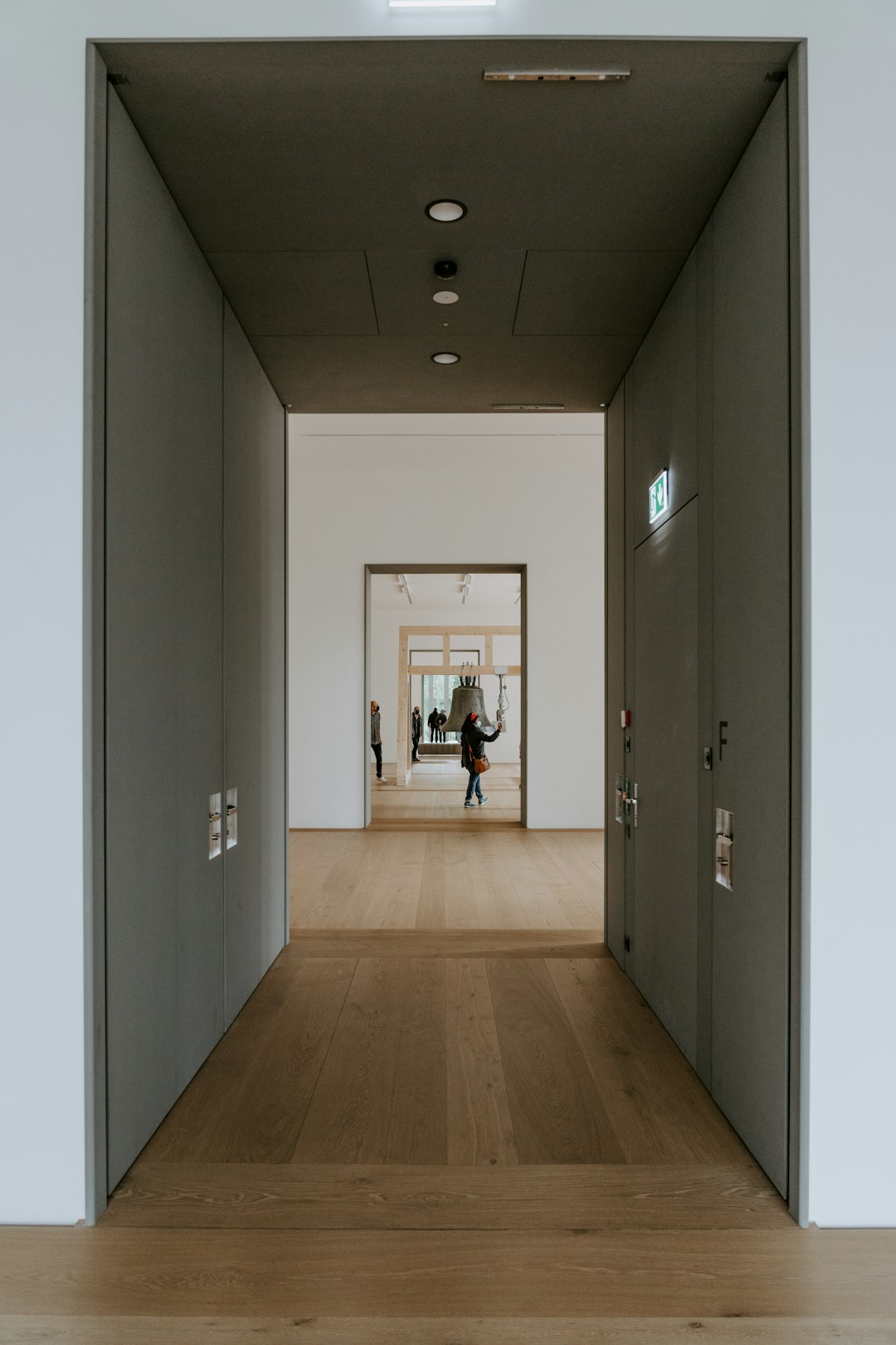 a person walking down a hallway in a building