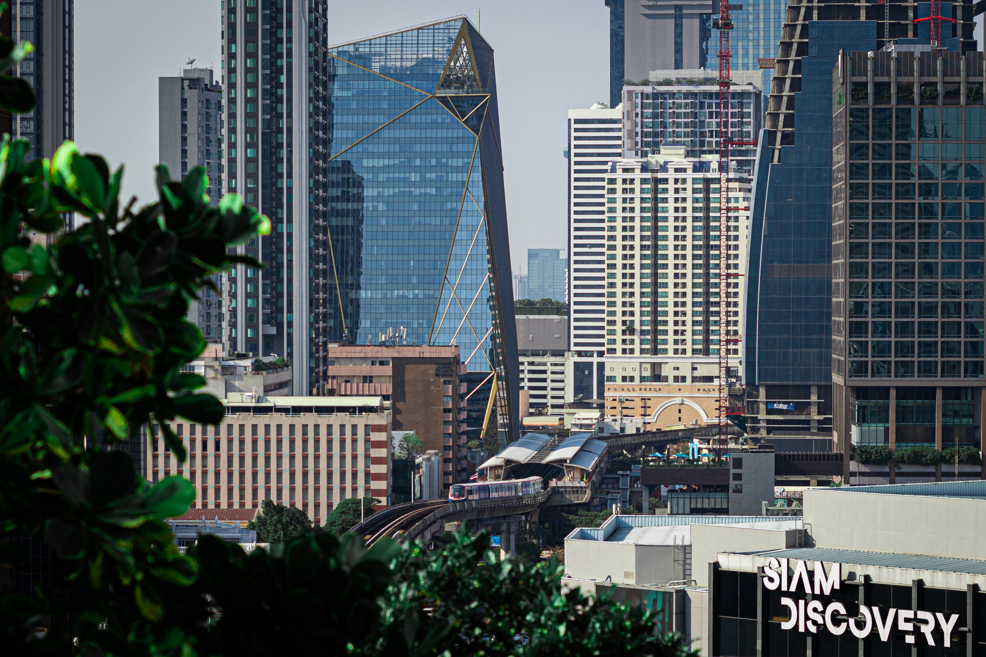 a view of a city with skyscrapers and a train
