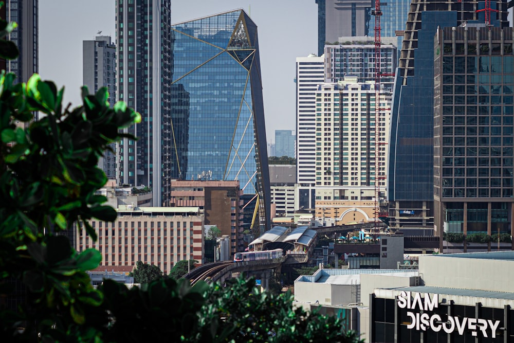 a view of a city with skyscrapers and a train