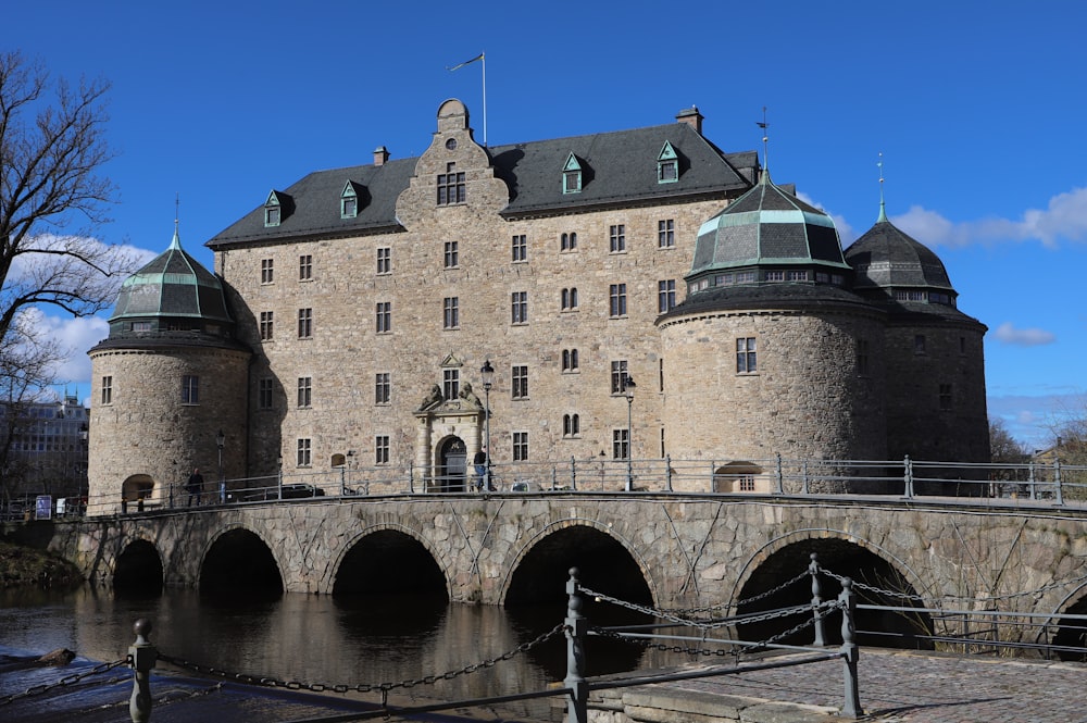 a large castle with a bridge going across it