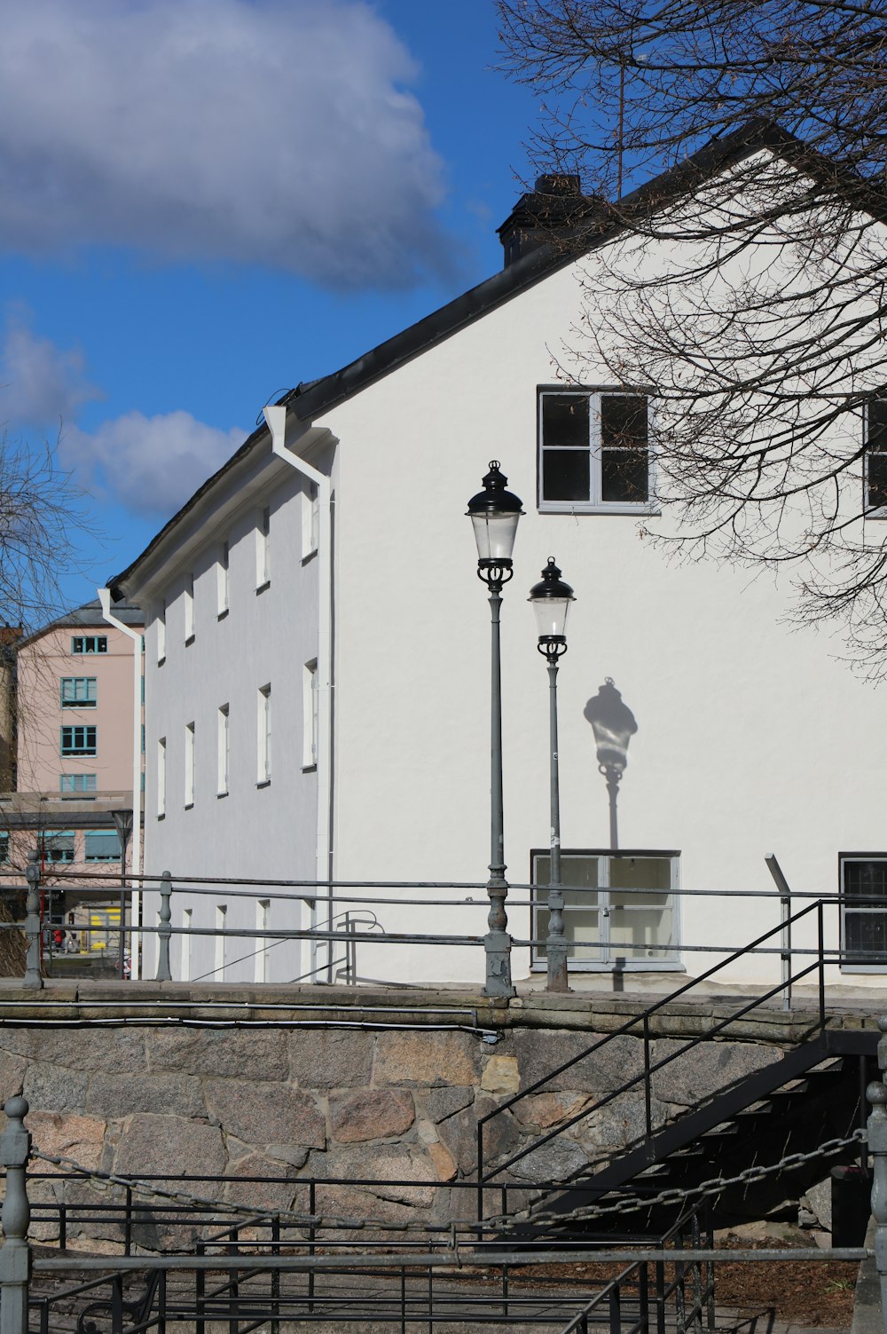 a white building with a clock on the side of it