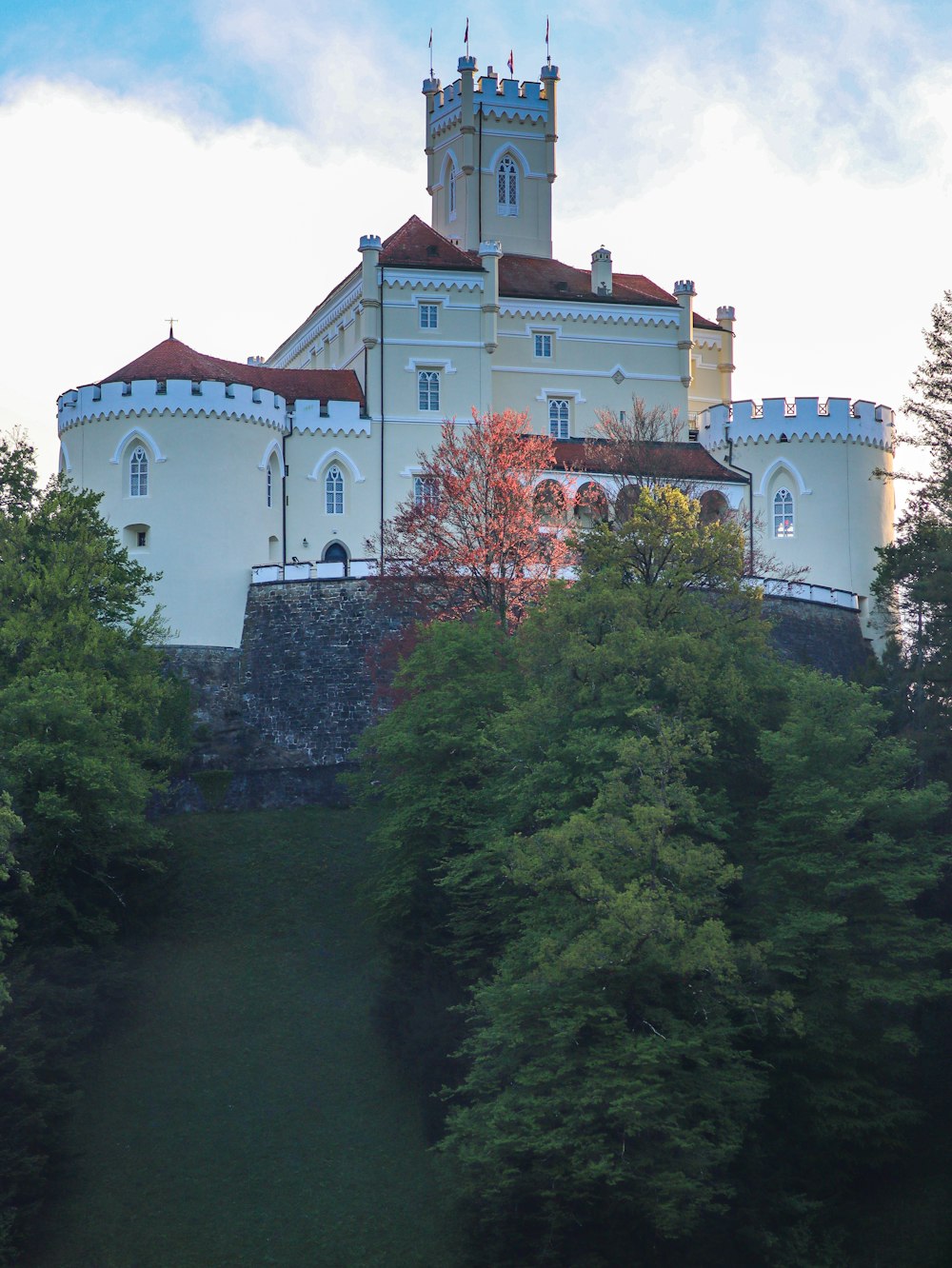 a large white building with a clock tower on top of it