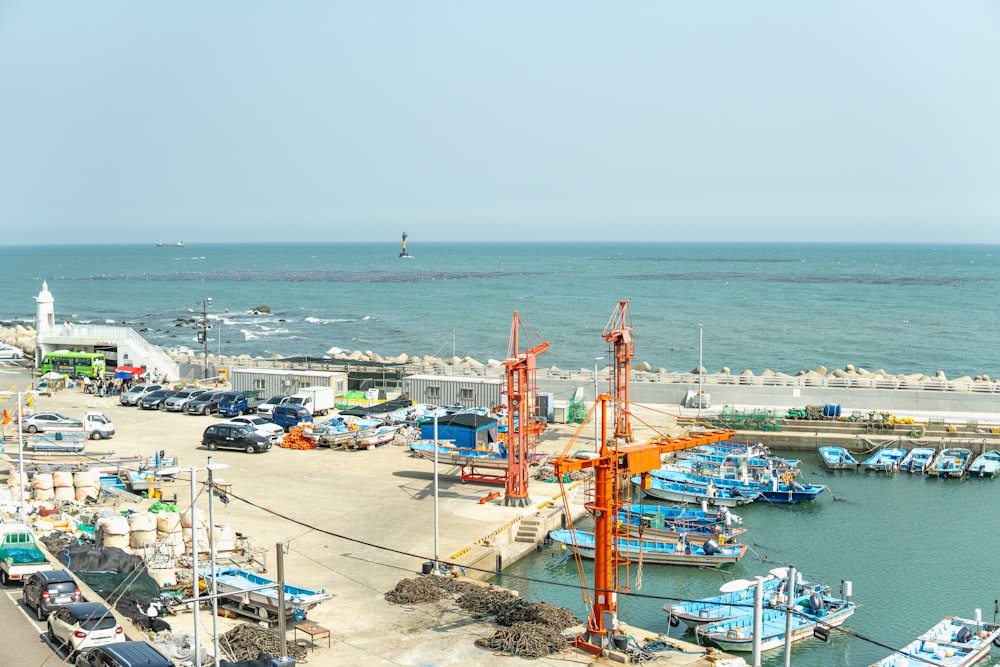 a harbor filled with lots of boats next to the ocean