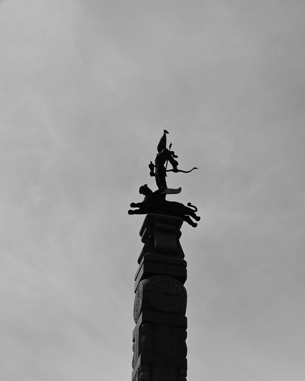 a black and white photo of a clock tower