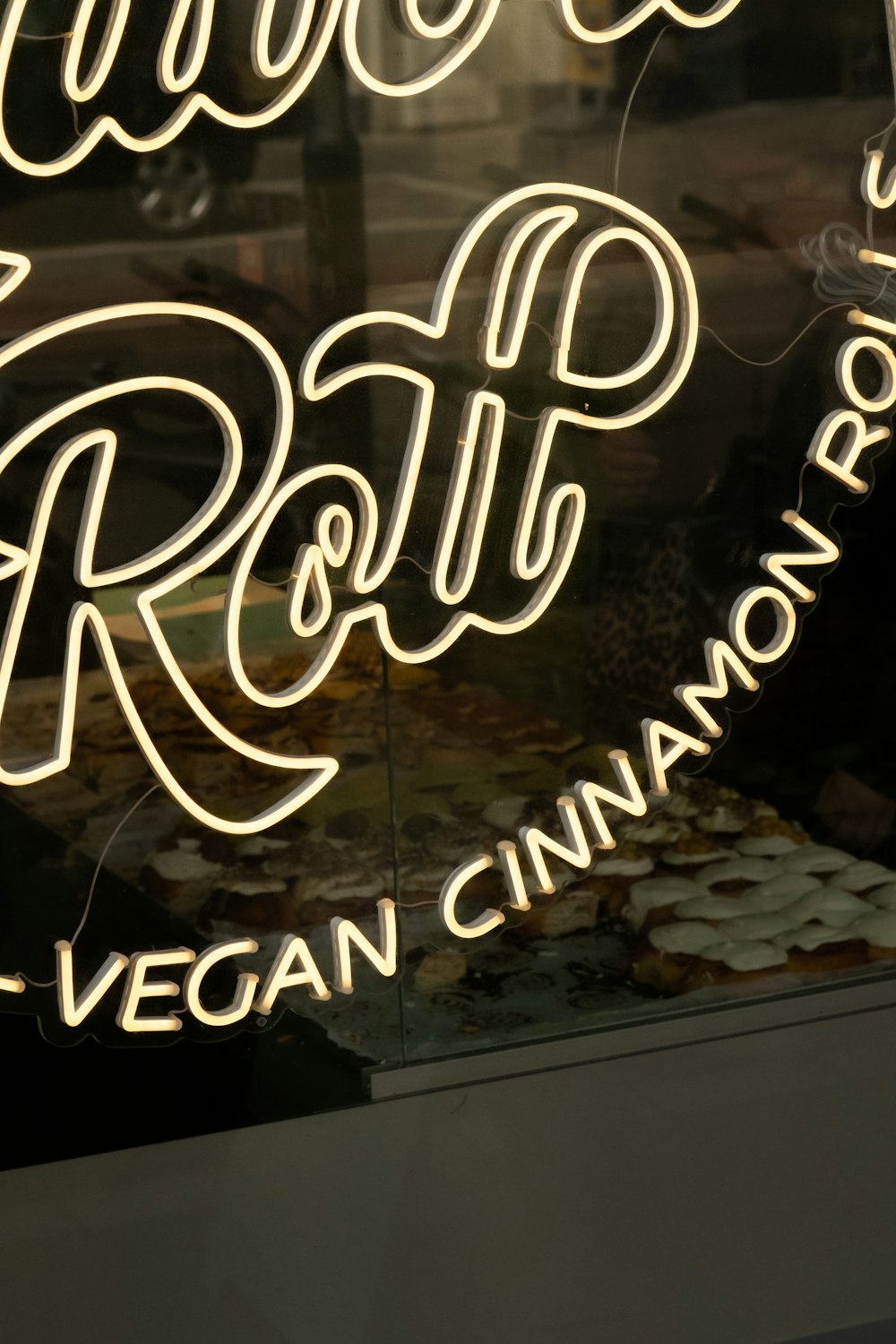 a neon sign in a window of a restaurant