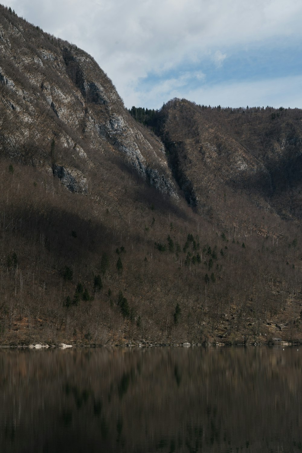 a mountain with a body of water in front of it