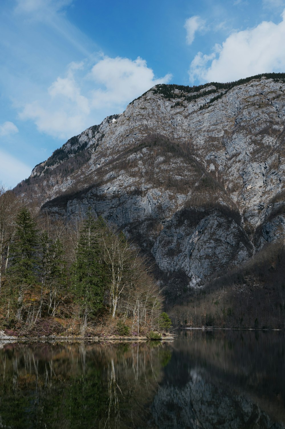 a mountain with a body of water in front of it