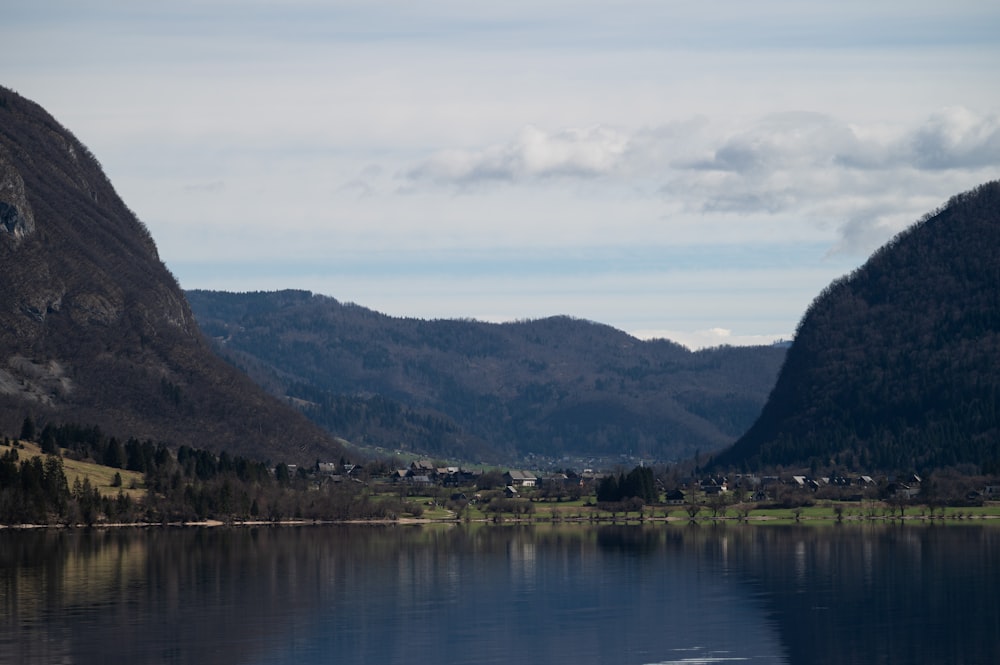 a body of water with mountains in the background