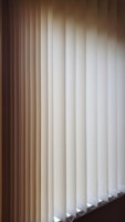 a close up of a closed window with blinds