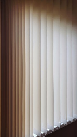 a close up of a closed window with blinds