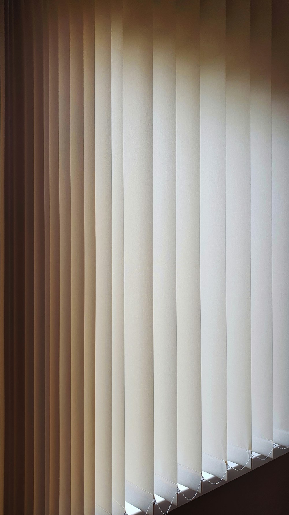 a close up of a closed window with blinds