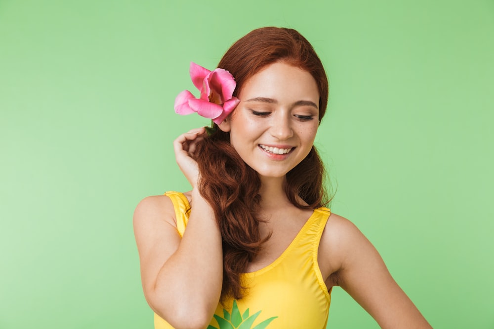 a woman with a flower in her hair