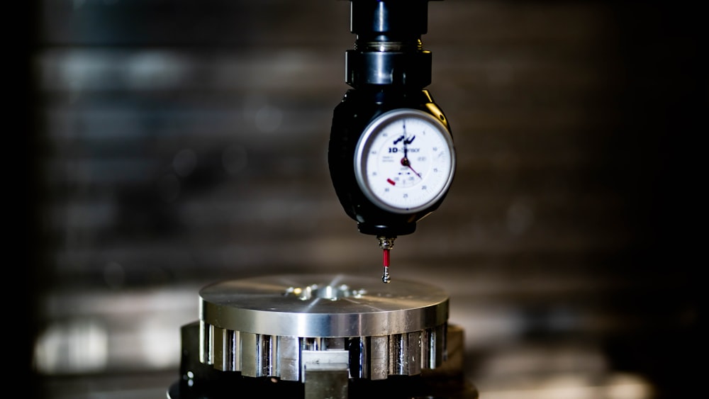 a close up of a pressure gauge on a table