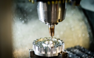 a machine that is cutting a piece of metal
