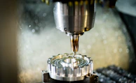 a machine that is cutting a piece of metal