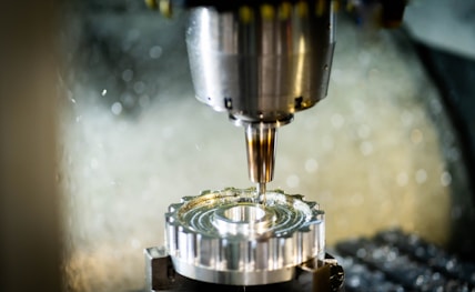 a machine that is cutting a piece of metal