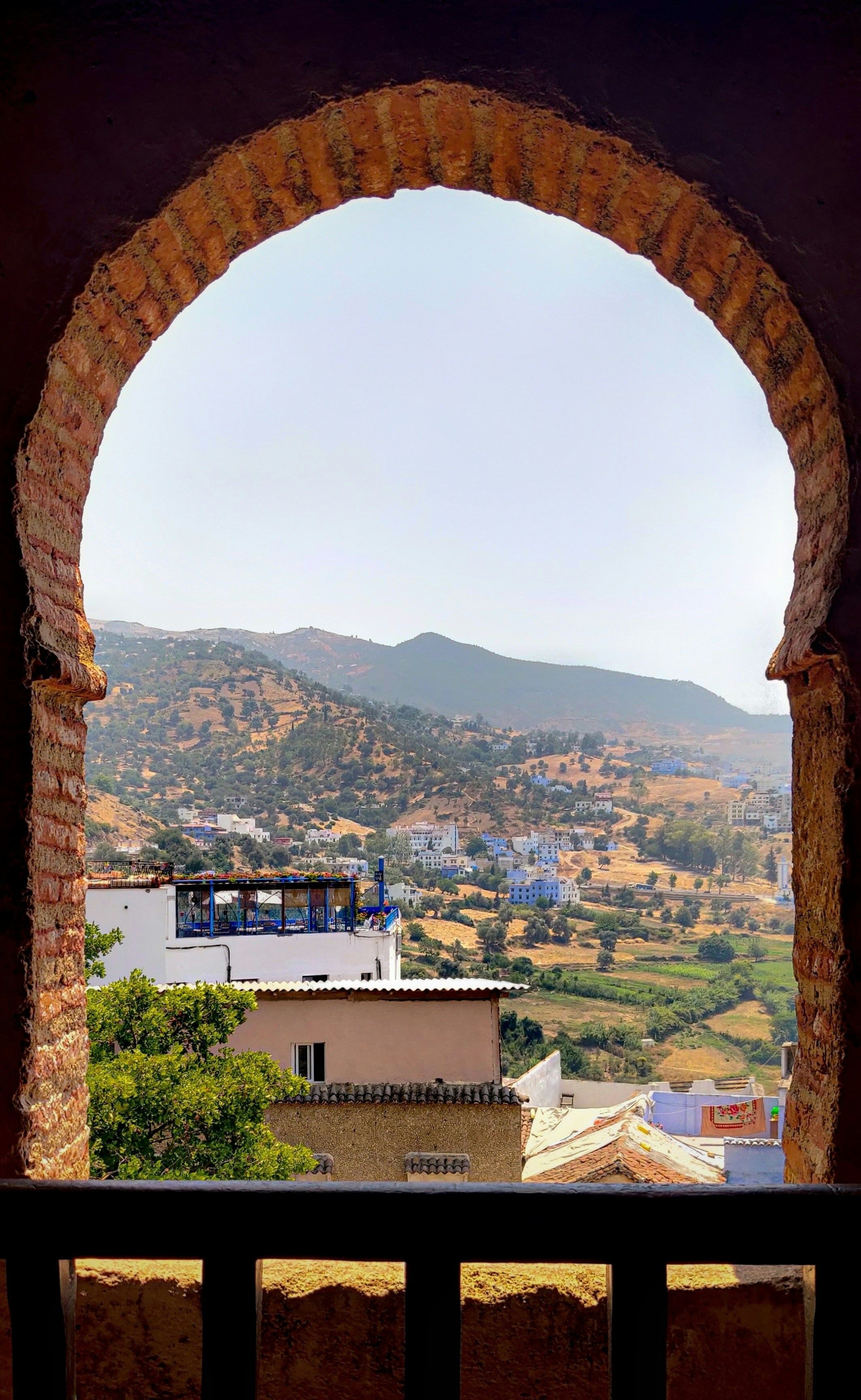 a view of a city from a window in a building