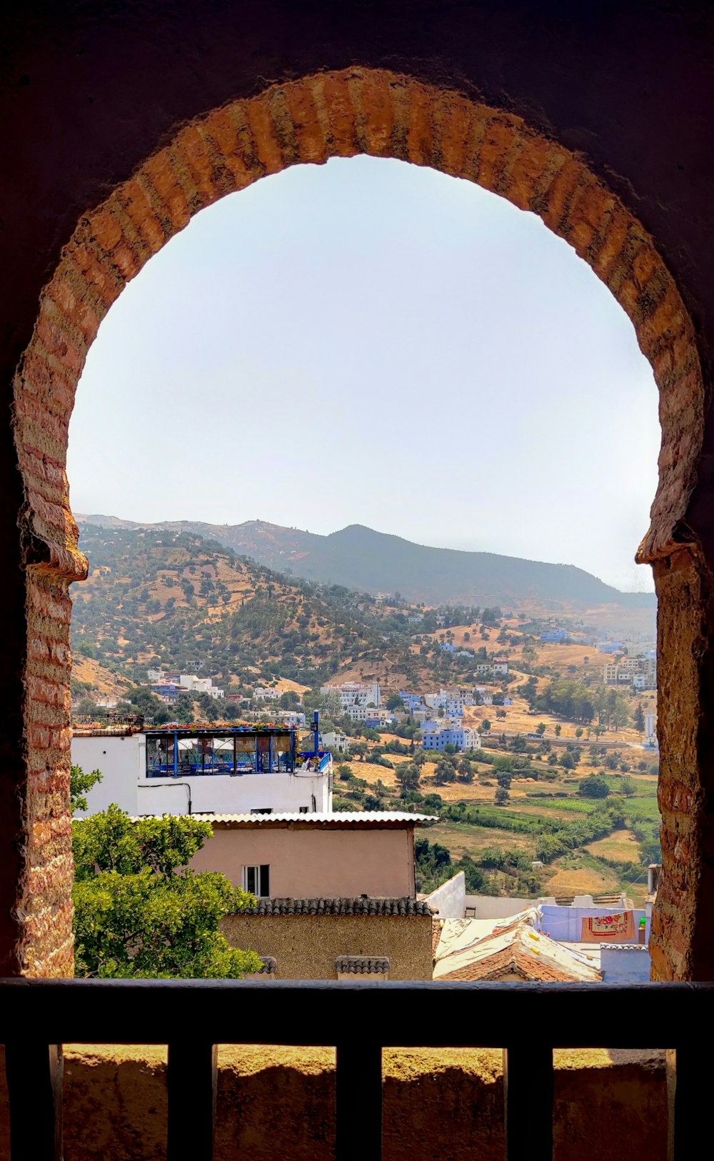 a view of a city from a window in a building