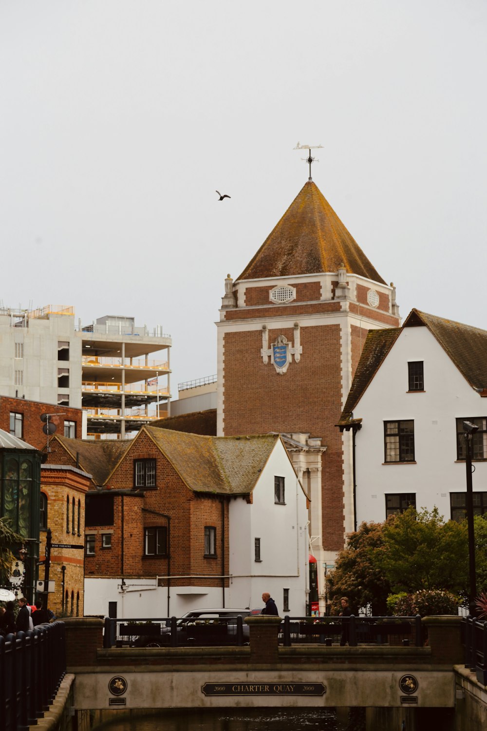 a clock tower in the middle of a city