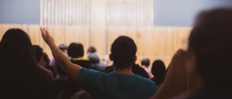a man standing in front of a crowd of people