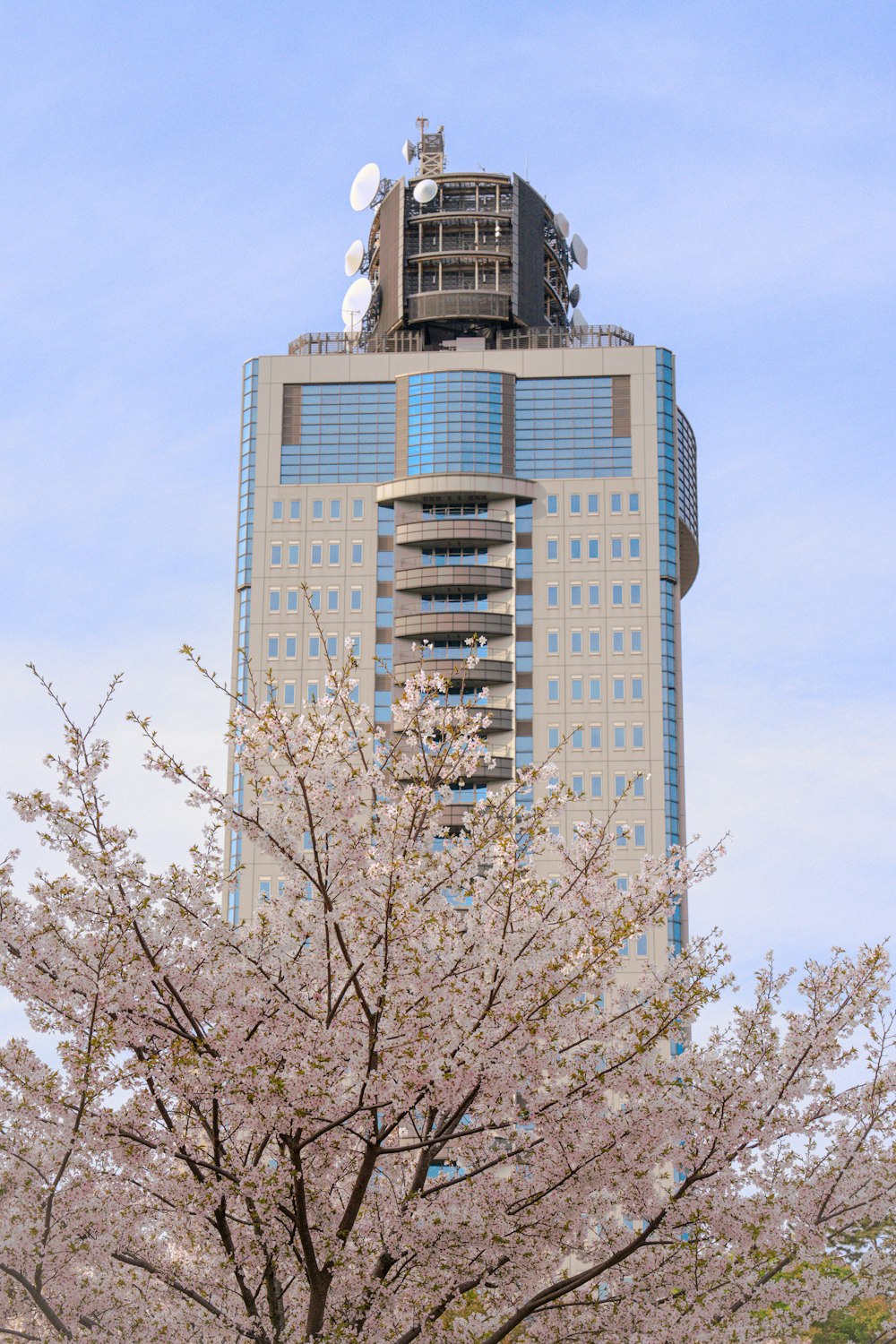 a tall building with a sky scraper on top of it