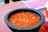 a bowl of soup sitting on top of a table