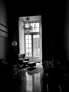 a black and white photo of a living room