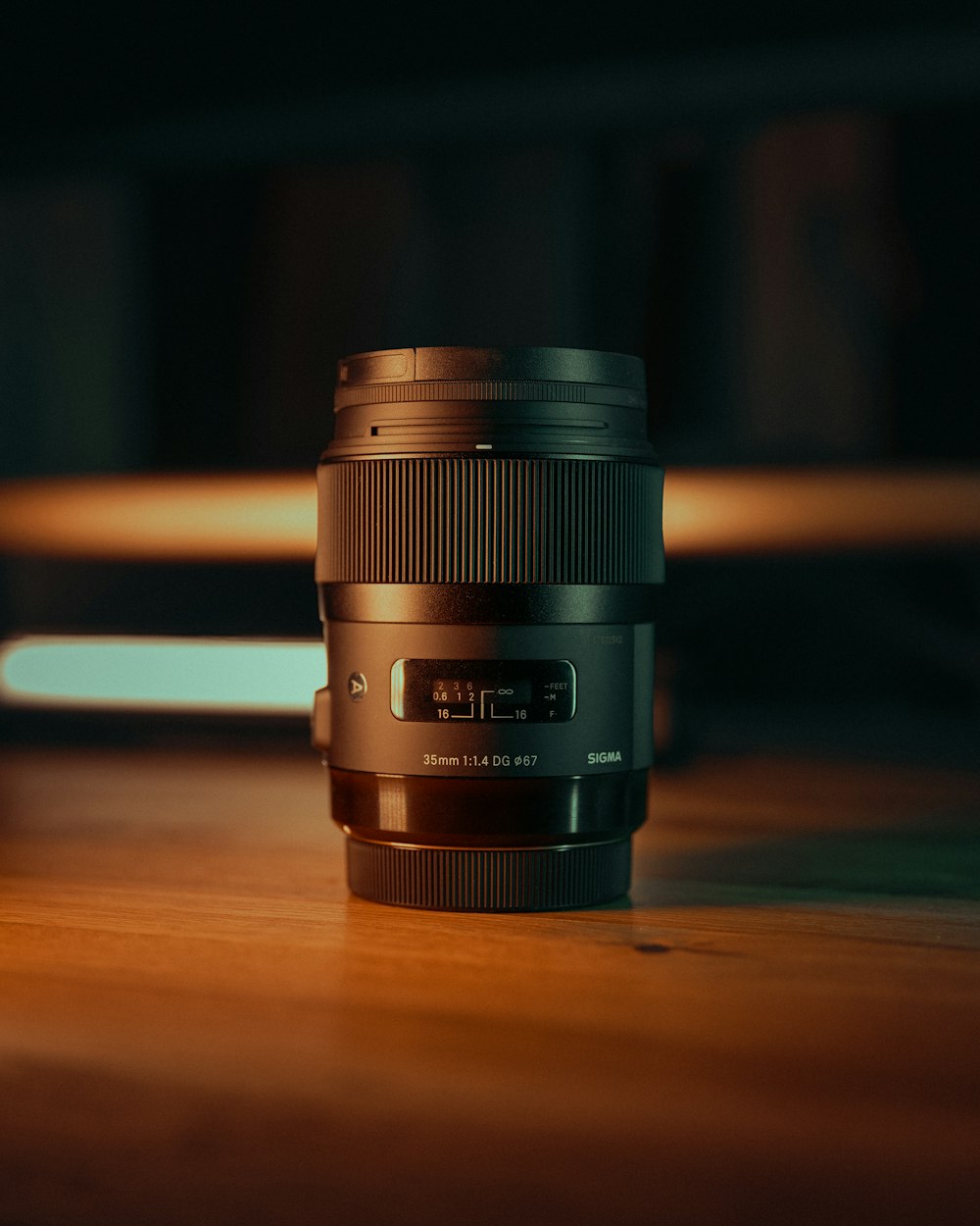 a camera lens sitting on top of a wooden table