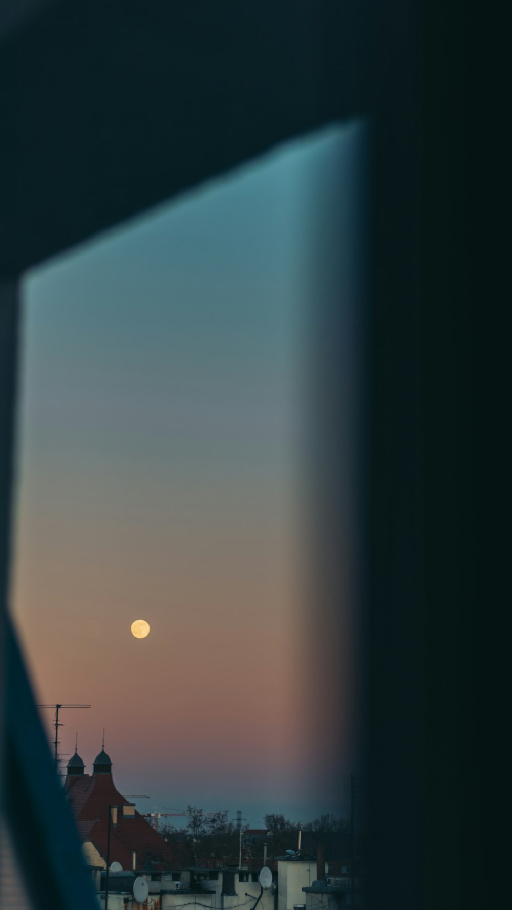 a view of the moon through a window