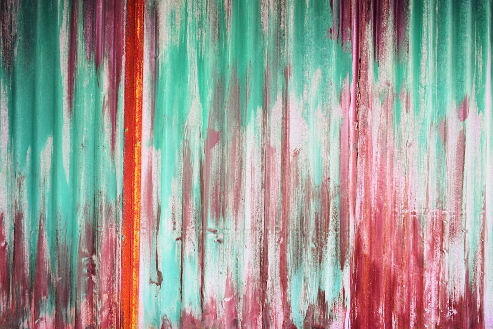 an abstract painting with red and green colors