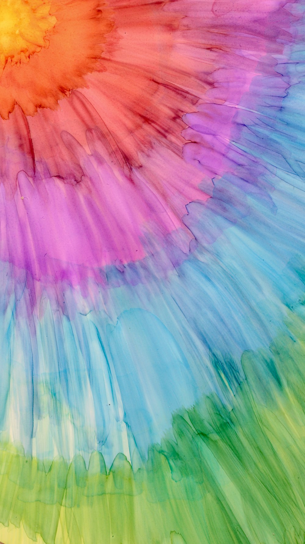 a multicolored tie - dyed background with a circular design