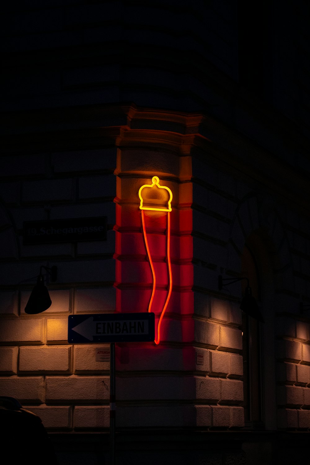 a neon sign on the side of a building