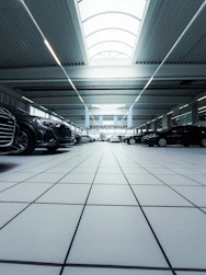 a car showroom filled with lots of black cars