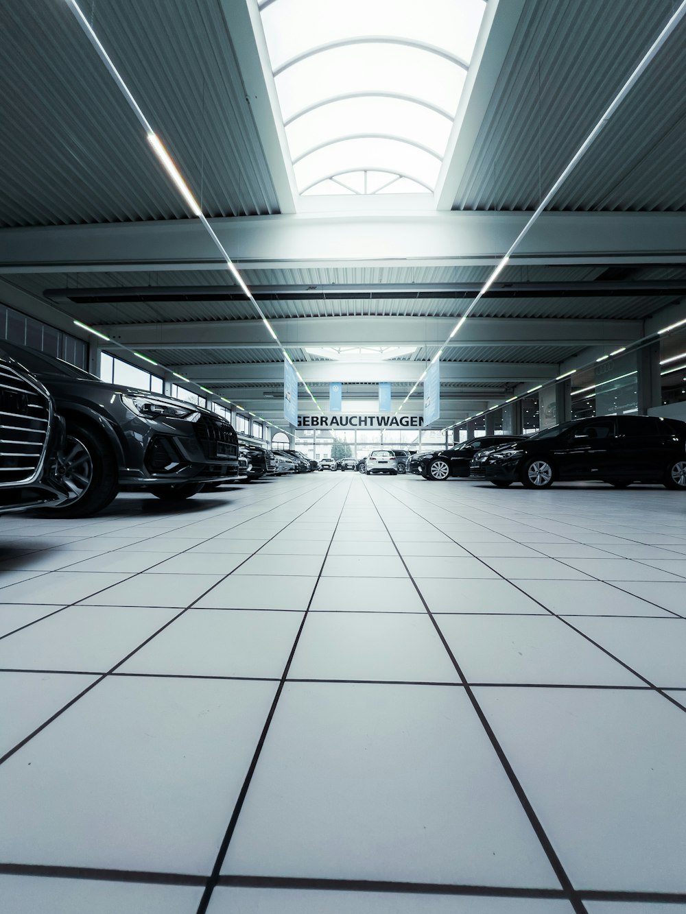 a car showroom filled with lots of black cars