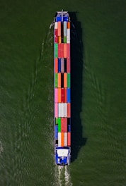 a large boat with a lot of colorful containers on it