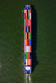 a large boat with a lot of colorful containers on it